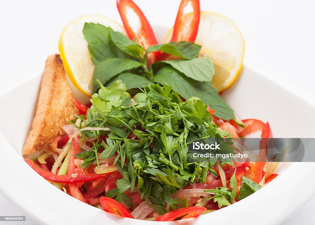 Salad Salad with lemon and bread on white plate Bread Stock Photo