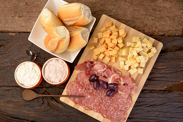 istock Charcuterie and Cheese Platter, Bread, Olives and Dippings 484693258