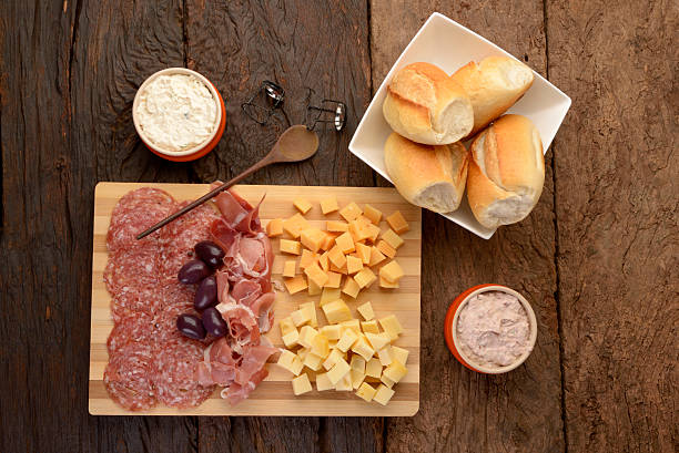 istock Charcuterie and Cheese Platter, Bread, Olives and Dippings 484693260