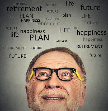 Closeup portrait of old man with glasses looking up contemplating about life isolated on gray wall background with copy space