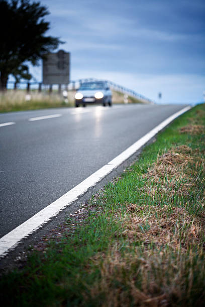 istock Country road at dusk, low-angle view 484698864