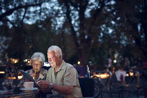 istock Senior couple using digital tablet outdoors 484701386