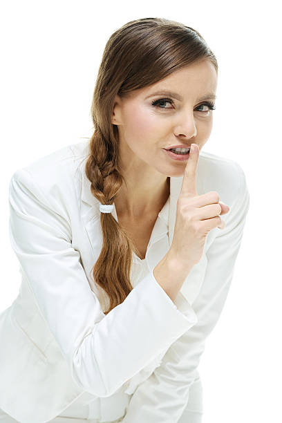 istock Businesswoman doing the be quiet sign 484701388