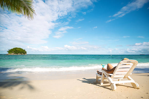 istock Girl relaxing on the beach 484701680