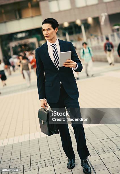 Mixed Ethnicity Businessman Using Tablet Stock Photo - Download Image Now - 2015, 30-34 Years, Adult