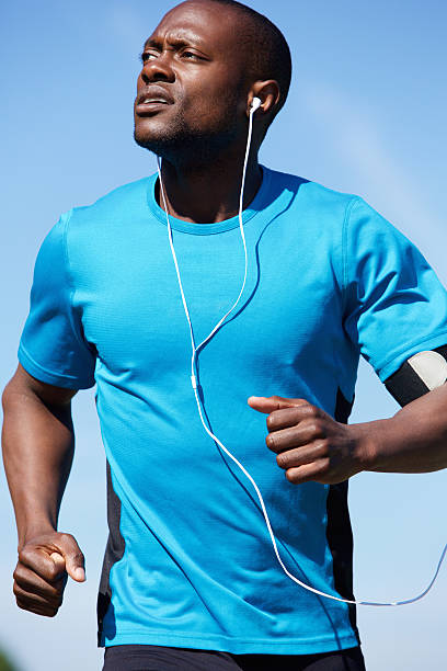 istock Healthy young man running outdoors 484703066
