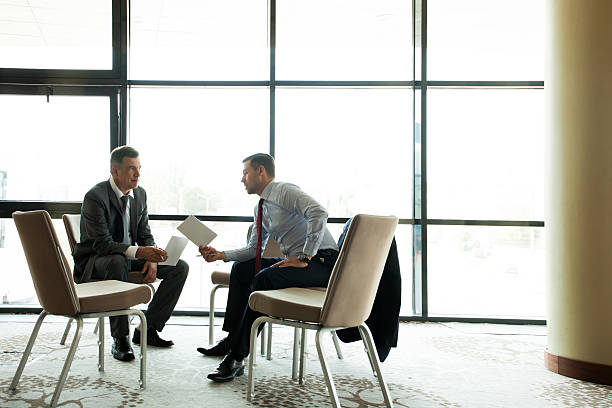 istock Coworkers discussing project in conference room 484703928
