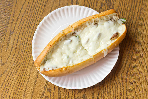 Philly Cheesesteak Philly Cheesesteak loaded with mozzarella cheese on submarine bun torpedo sandwich stock pictures, royalty-free photos & images