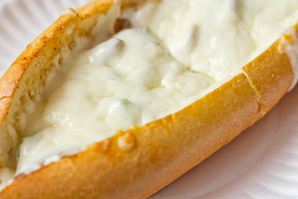 Philly Cheesesteak Philly Cheesesteak loaded with mozzarella cheese on submarine bun torpedo sandwich stock pictures, royalty-free photos & images