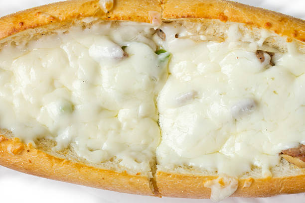 Philly Cheesesteak Philly Cheesesteak loaded with mozzarella cheese on submarine bun torpedo sandwich stock pictures, royalty-free photos & images