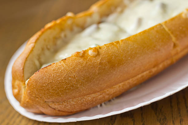 Philly Cheesesteak Philly Cheesesteak loaded with mozzarella cheese on submarine bun torpedo sandwich stock pictures, royalty-free photos & images