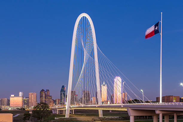 Dallas downtown skyline with Margaret hut hills bridge at night.