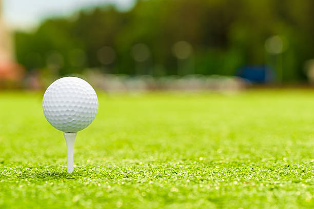 istock golf ball on the tee is right space for inscription 484705372