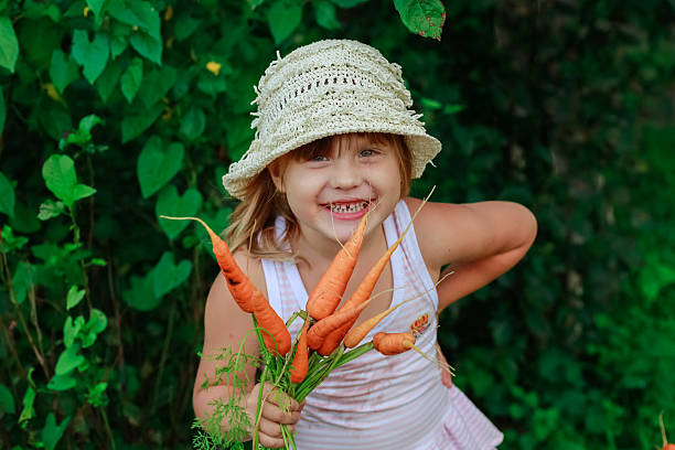 istock Girl gnaws carrot 484706022