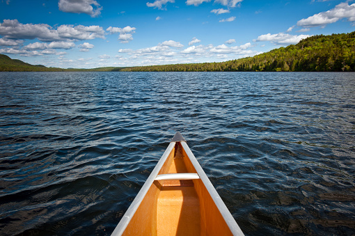 Bow of a canoe on a quiet lake in Northern Maine.