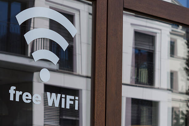 istock free wifi symbol - wireless internet icon on shop window 484707816