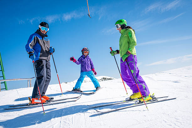 istock Family enjoying ski holiday 484709906