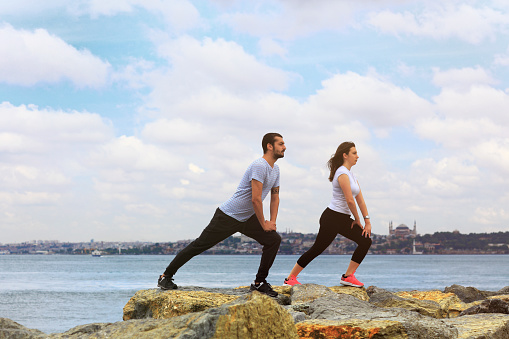 Couple exercising near Istanbul Bosphorus.