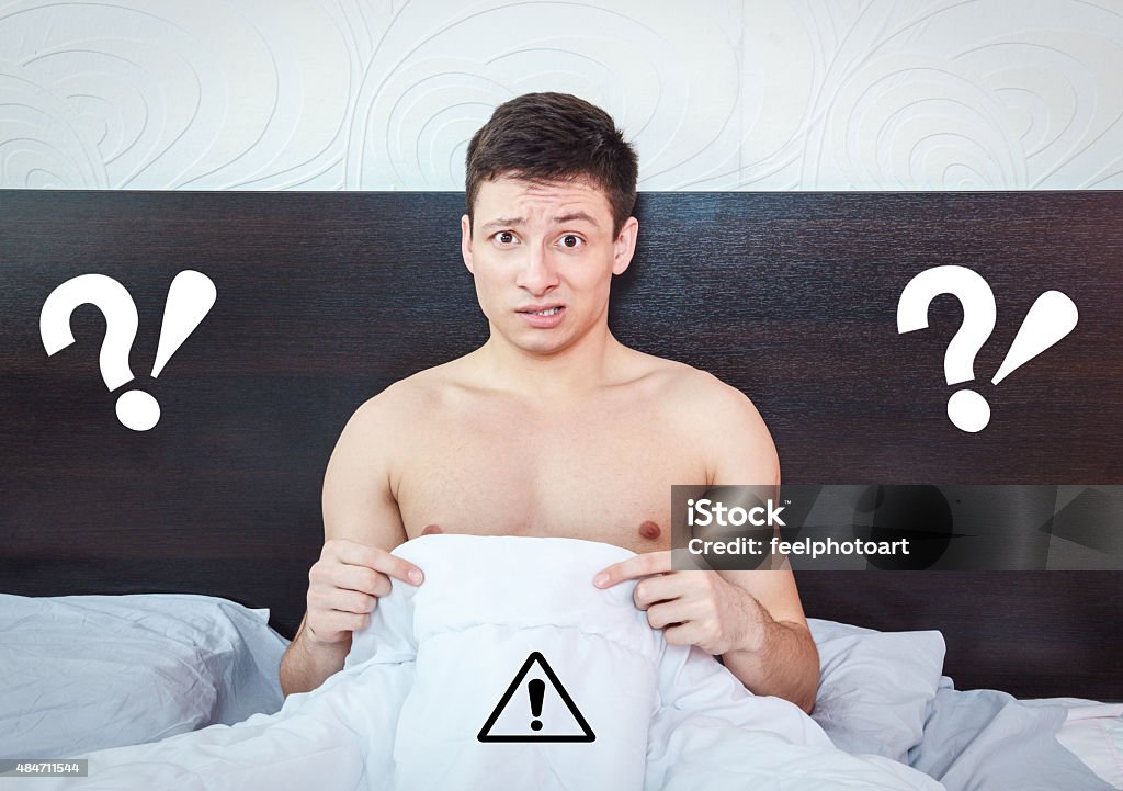 Young man thinking about impotency problems and prostate Young man thinking about impotency problems and wondering about prostate trouble , Rejected man feeling shame of his erection failure Erection Stock Photo