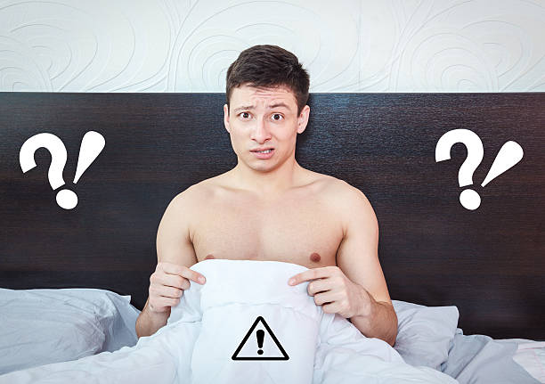 Young man thinking about impotency problems and prostate stock photo