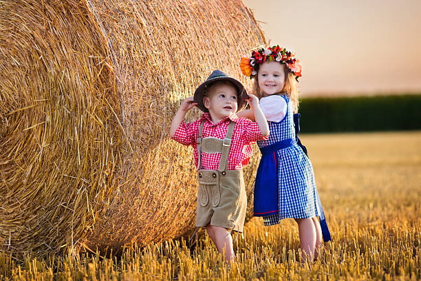 Kids playing in wheat field in Germany