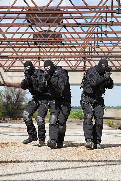 Special forces in action Special forces operators in black uniform in action spetsnaz stock pictures, royalty-free photos & images