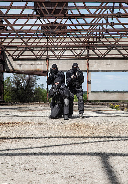 Special forces in action Special forces operators in black uniform in action spetsnaz stock pictures, royalty-free photos & images