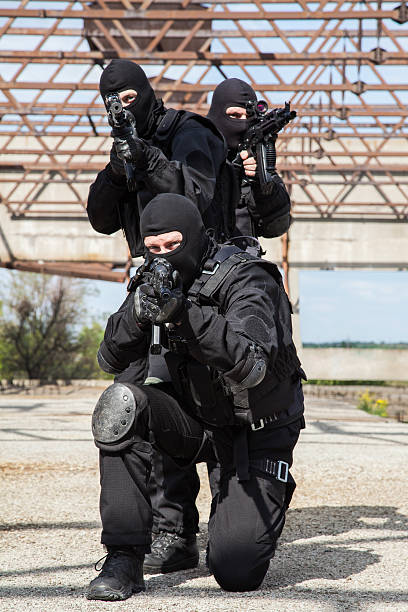 Special forces in action Special forces operators in black uniform in action spetsnaz stock pictures, royalty-free photos & images