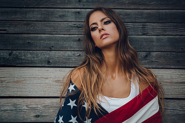 istock Young woman with American flag. 484712592