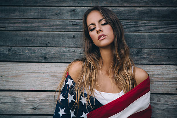 istock Young woman with American flag. 484712594