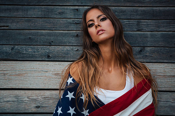 istock Young woman with American flag. 484712598