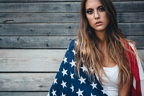 istock Young woman with American flag. 484712602