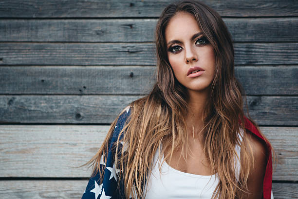 istock Young woman with American flag. 484712606