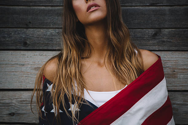 istock Young woman with American flag. 484712608