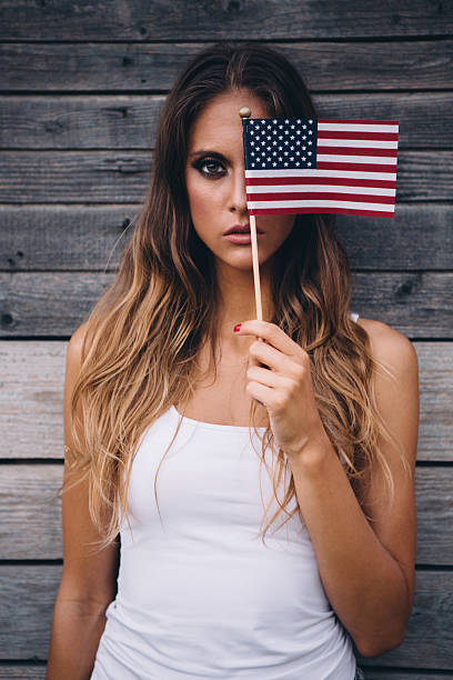 istock Young woman with American flag. 484712612