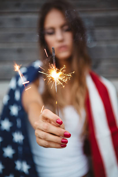 istock Young woman with American flag. 484712622