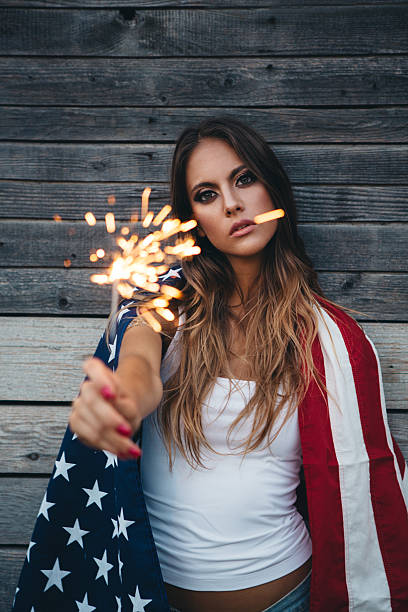 istock Young woman with American flag. 484712646