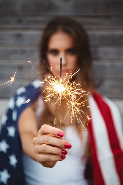 istock Young woman with American flag. 484712664