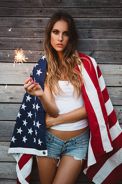 istock Young woman with American flag. 484712672