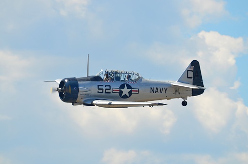 Broomfield, CO, USA - August 15, 2015: Old navy war aircraft flying at the Rocky Mountain Airshow. 
