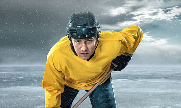 istock Ice hockey player on the ice in mountains 484714202