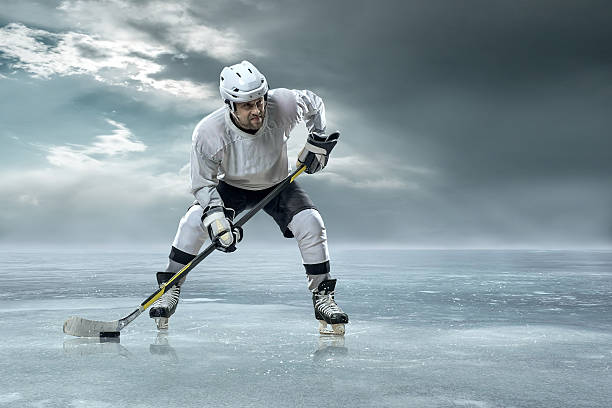istock Ice hockey player on the ice in mountains 484714278