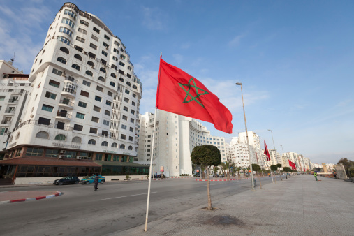 Tangier, Morocco - March 22, 2014: Ordinary morning with walking people on avenue Mohammed VI in new part of Tangier