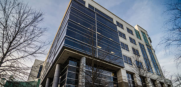 modern architecture with glass and columns and metal panels