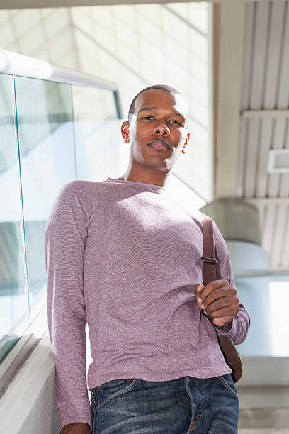 istock Serious young African American man walking down stairs 484715021