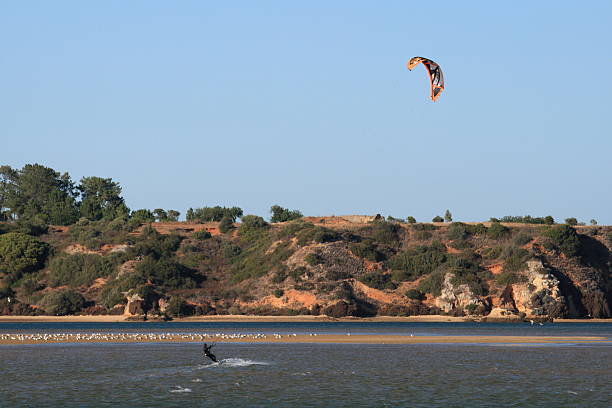 Kite Surfer A Kite surfer in the Odiaxere estuary, Alvor, Portugal. alvor stock pictures, royalty-free photos & images