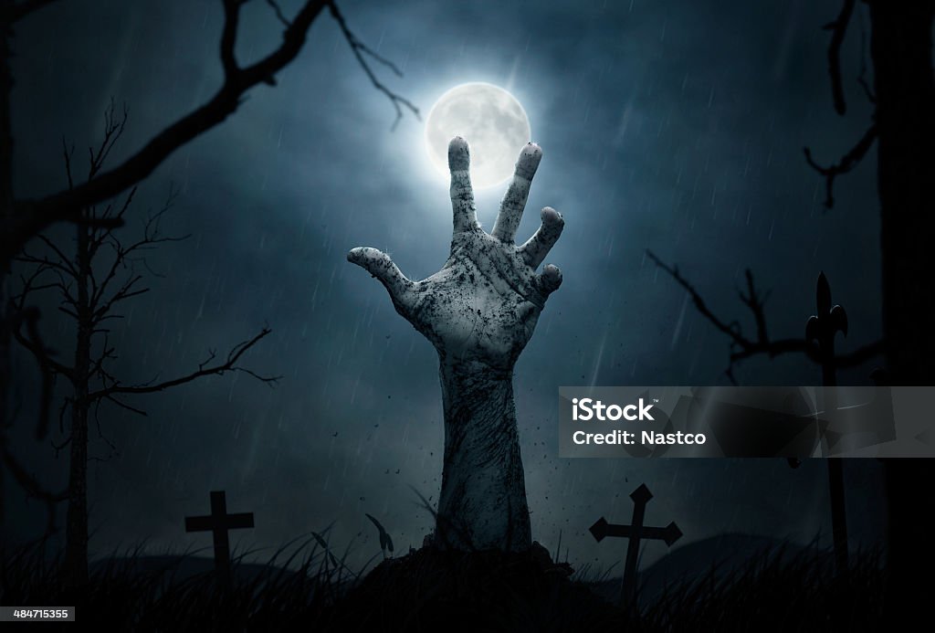 Zombie's hand Halloween concept, dead man's hand coming out from the grave Zombie Stock Photo