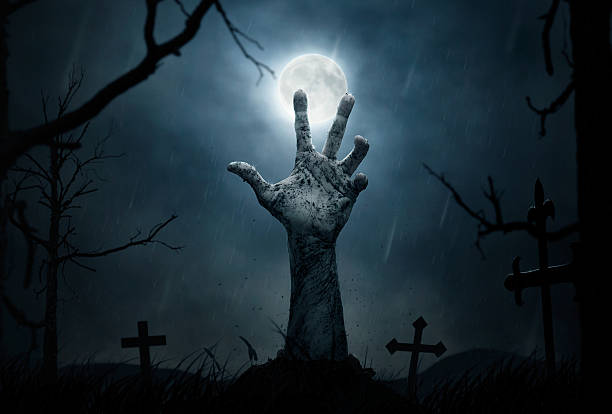 Zombie's hand Halloween concept, dead man's hand coming out from the grave tomb photos stock pictures, royalty-free photos & images