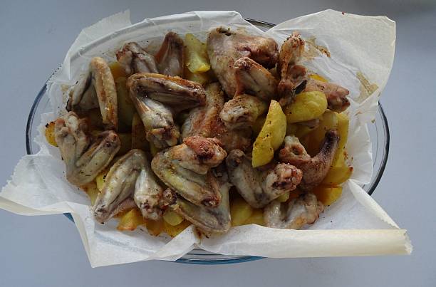 istock Chicken wings with Potatos 484715838