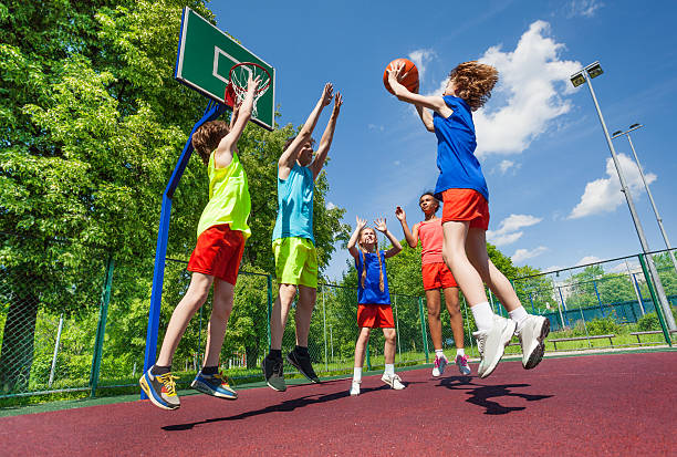 istock Teens jump for ball during basketball game 484716660